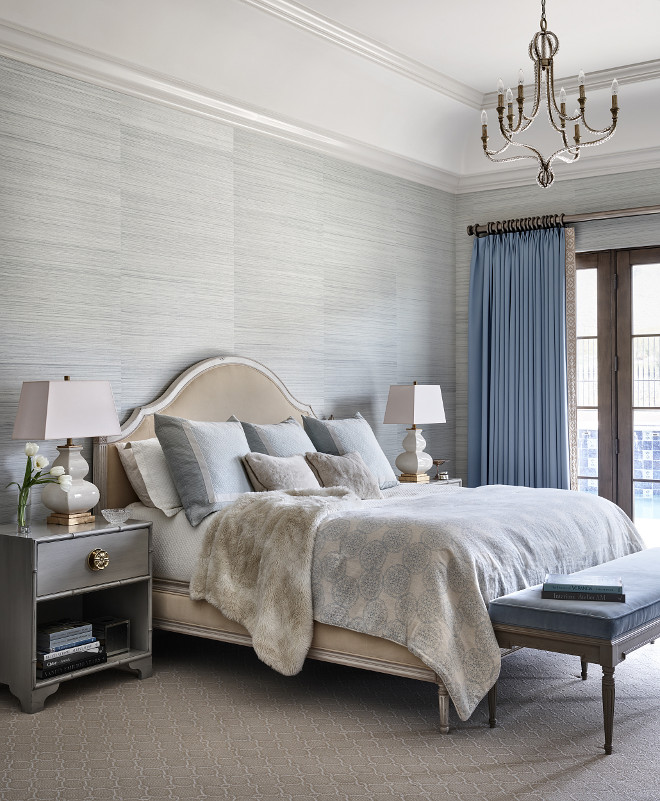 Master bedroom. Master bedroom features a grey wallpaper, a French beaded chandelier and a bench at the end of the bed #Masterbedroom #Masterbedroomdesign #greywallpaper #Frenchbeadedchandelier #benchattheendofthebed Kim Scodro Interiors