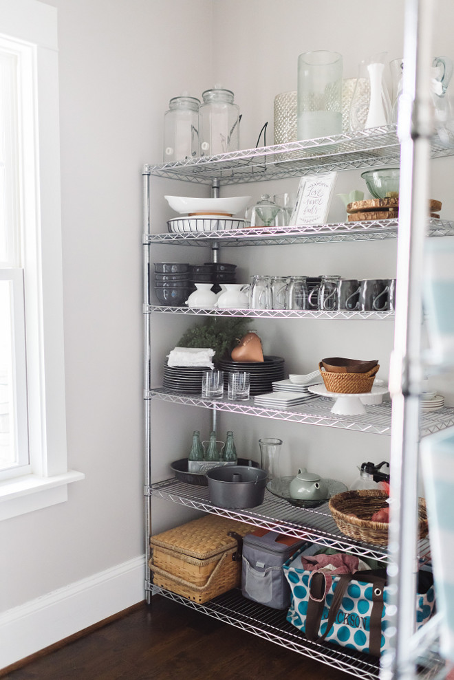Pantry shelves. Pantry shelves. Affordable pantry shelves from Home Depot. We used chrome shelving to display our serving dishes and canvas baskets to house our food. I love that everything is on display, it gives the space a fun bakery feel. #pantryshelves Beautiful Homes of Instagram @thegraycottage