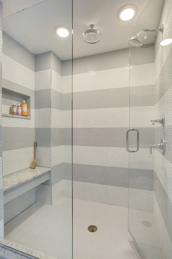 Striped White and Grey Penny Round Shower Tile. White and grey penny round tiles create a fun striped pattern in this shower. Striped White and Grey Penny Round Shower Tiles. Tile (White Shower Walls & Floors): Penny Round Bay Glazed, Bright White (with grey grout on walls and white grout on floor). Grey Tile: AU Penny Rounds BRP 3030 #StripedWhiteandGreyShower #Showertile #stripedshowertile #PennyRoundShowerTile #PennyRoundTile Revision LLC