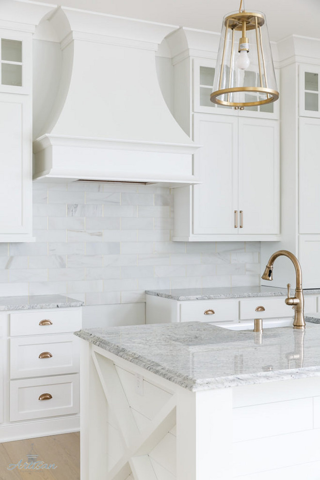 White kitchen with white and grey granite countertop. The countertops are a granite called Salinas. Crisp White kitchen with white and grey granite countertop #Whitekitchen #whiteandgreygranite #whiteandgreygranitecountertop #whitegranite Interior Design by Gretchen Black from Greyhouse Design.