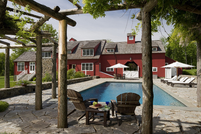 A rustic pergola provides a shady spot beside the pool, Barn style home backyard ideas #barnstylehome #barn #redbarn #pool #backyard #rusticpergola Haver & Skolnick LLC Architects