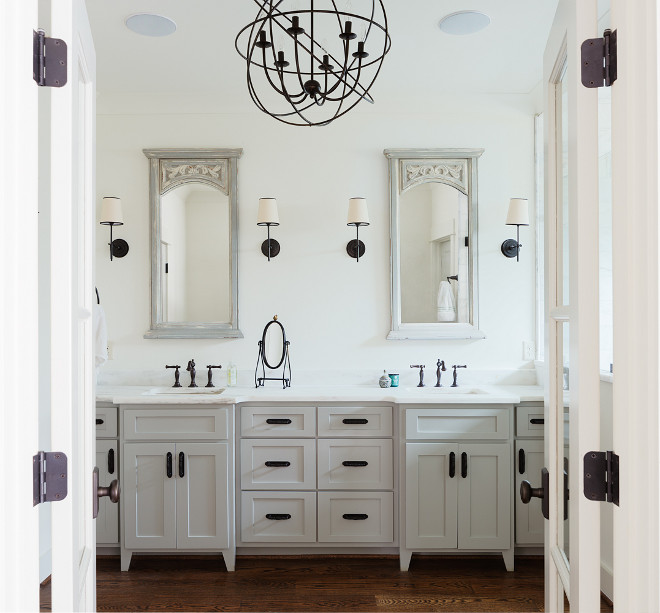 Bathroom with oil rubbed bronze lighting, oil rubbed bronze hardware and oil rubbed bronze faucets. Cabinet paint color is Benjamin Moore OC-52 Gray Owl. #Bathroom #oilrubbedbronze #oilrubbedbronzelighting #oilrubbedbronzehardware #oilrubbedbronzefaucets Willow Homes