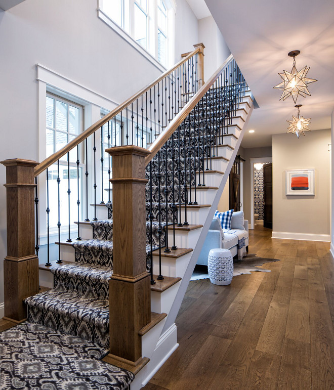Beautiful open staircase with patterned carpet and wrought iron spindles leading to the 2nd floor #openstaircase #patternedcarpet #stairrunner #wroughtironspindles Grace Hill Design