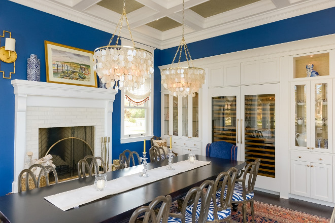 Dining room with built in wine cellar. This dining room features coffered ceiling and built-in flanking a pair of Sub Zero wine coolers. Built in wine cellar. Dining room with built in cabinets and wine cellar #Diningroom #builtinwinecellar #winecellar Echelon Custom Homes