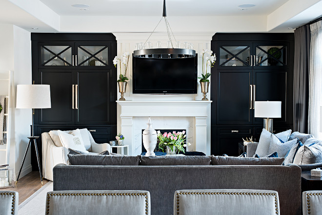 Family room with black built in cabinets painted in Benjamin Moore Onyx. Benjamin Moore 2133-10 Onyx #BenjaminMoore213310Onyx #BenjaminMooreOnyx Sarah St. Amand Interior Design, Inc 