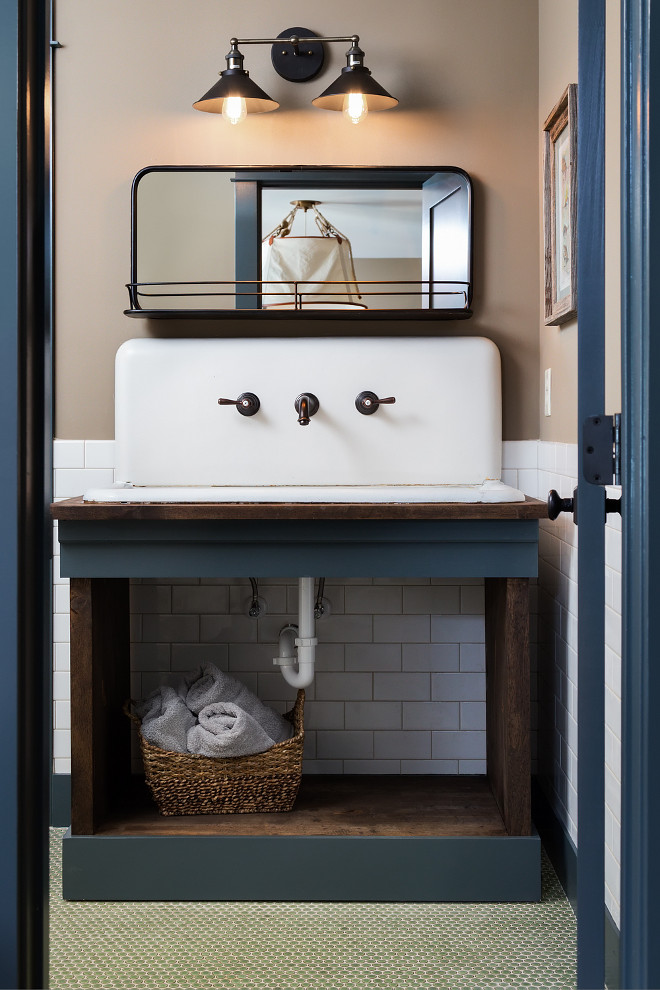 Farmhouse Bathroom Vanity. Farmhouse Bathroom Vanity. This farmhouse bathroom features a 42" wide vintage sink Paint color is Down Pipe by Farrow & Ball. Farmhouse Bathroom with navy blue and reclaimed wood vanity. Farmhouse Bathroom Vanity #FarmhouseBathroom #FarmhouseVanity #Farmhouse Willow Homes