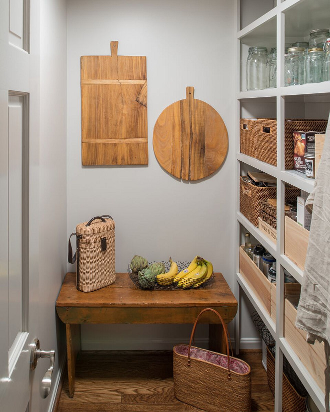 Farmhouse Pantry. Farmhouse Pantry. In this farmhouse pantry, open pantry shelves stocked with wicker baskets and hanging wooden cutting boards make it easy for everyone to help with meal preparations. Farmhouse Pantry. Grey Farmhouse Pantry. #FarmhousePantry #Pantry Anthony Wilder Design/Build, Inc
