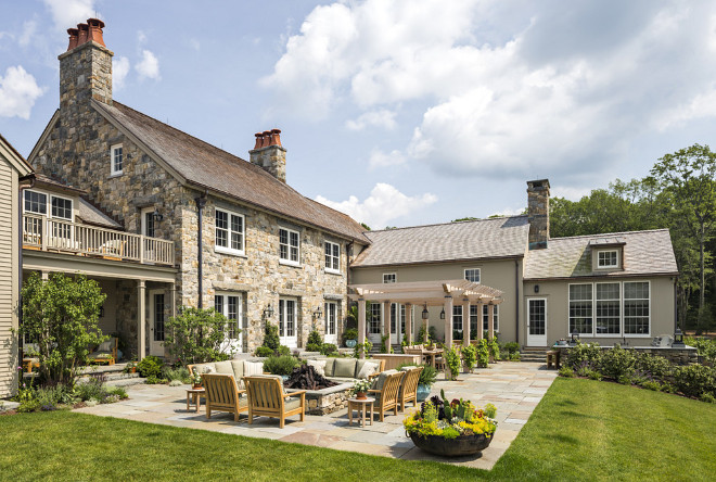 Farmhouse Patio The rear terrace is the focus of the family's outdoor living and includes a pergola, outdoor kitchen and fire pit #Farmhouse #patio #Terrace Haver & Skolnick LLC Architects