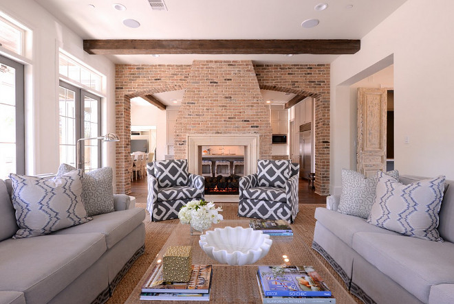Living room with open brick fireplace dividing family room from kitchen. Living room with open brick fireplace dividing family room from kitchen ideas. Living room with open brick fireplace dividing family room from kitchen. Living room with open brick fireplace dividing family room from kitchen #Livingroom #openbrickfireplace #brickfireplace #familyroom #kitchen Munger Interiors