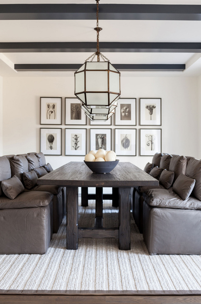 Modern Farmhouse Dining Room with leather dining chairs The leather dining chairs are RH Cloud Dining Leather Side Chair, The chairs harmonize with a reclaimed-wood dining table and a series of botanical prints by German photographer Karl Blossfeldt #ModernFarmhouse #DiningRoom Chango & Co