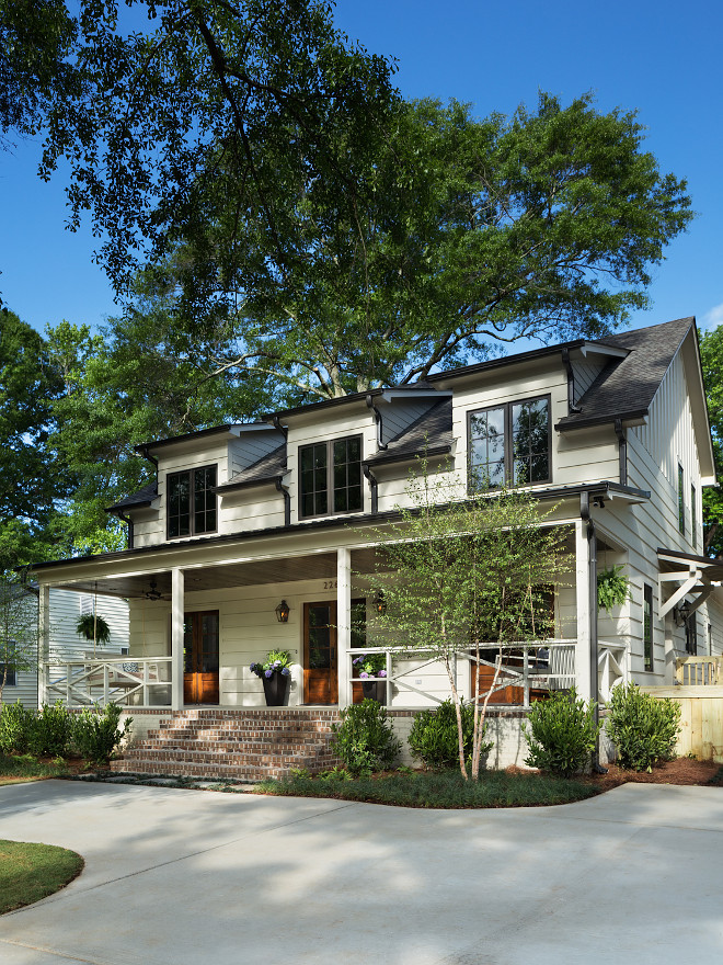 Modern Farmhouse with front porch. The off-white exterior paint color is Old White by Farrow and Ball. Gutters are Dark Bronze by Farrow and Ball also. Modern Fixer Upper Farmhouse with front porch. Modern Fixer Upper Farmhouse with front porch. Modern Fixer Upper Farmhouse with front porch ideas #ModernFixerUpperFarmhouse #FixerUpperFarmhouse #ModernFarmhouse #frontporch Willow Homes