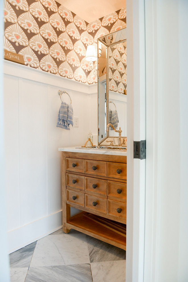 Powder Room Wainscotting. A warm wallpaper brings some extra character to this powder room with board and batten wainscoting. Powder Room Wainscotting. Powder Room Wainscotting. Powder Room Wainscotting #PowderRoomWainscotting #PowderRoom #Wainscotting #Boardandbatten Echelon Custom Homes