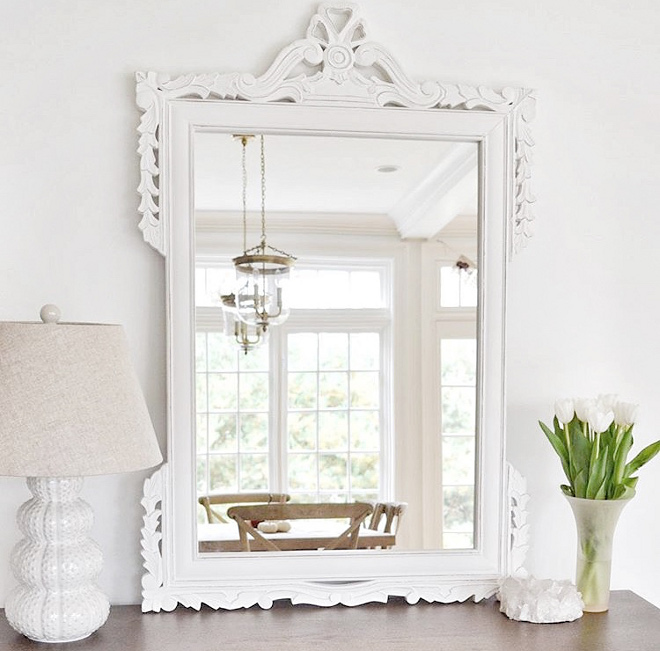 White Mirror in Dining Room. Wood mirror painted in white. The painted white wood mirror is from Overstock and the lamp is from HomeGoods.Dining Room Mirror #mirror #paintedmirror #whitemirror Beautiful Homes of Instagram @HomeSweetHillcrest