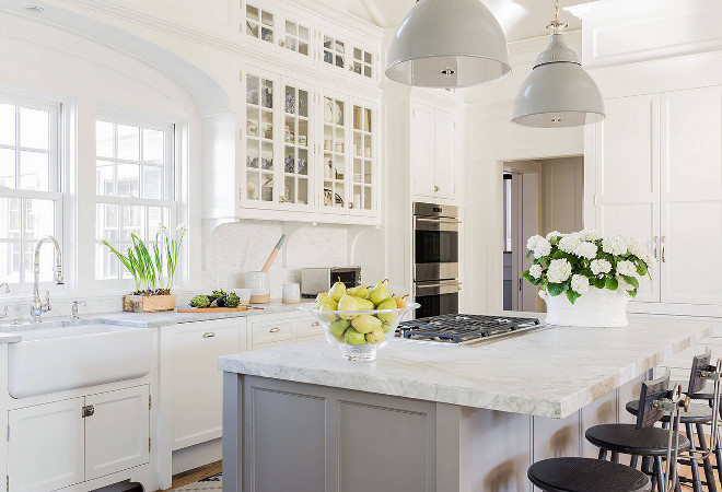 White and grey kitchen paint color. White kitchen cabinet paint color is Benjamin Moore White Dove and the grey kitchen island paint color is Farrow and Ball Soft Moodiness. Kitchen thick countertop is Super White Quartzite. Kitchen Lighting is Rover Light, Ann-Morris #Whiteandgreykitchen #paintcolor #Whitekitchen #cabinetpaintcolor #BenjaminMooreWhiteDove #greykitchenisland #paintcolor #FarrowandBallSoftMoodiness Nancy Serafini Interior Design