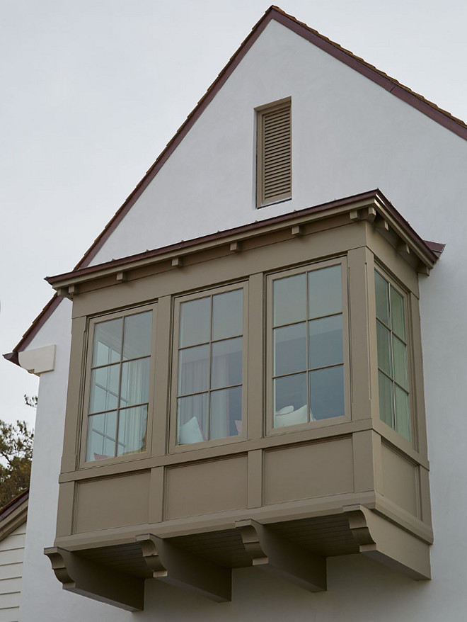 Window Trim and Corbels. Beautiful window trim and corbels, painted in a deep mushroom paint color, contrasts with the off-white exterior. Exterior Window Trim and Corbels. Window Trim and Corbels #WindowTrim #Corbels #Windowcorbel Andrew Howard Interior Design