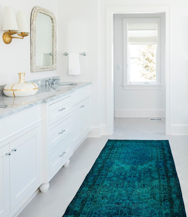 Bathroom Runner. Teal bathroom runner is by Fay + Belle. A gorgeous teal runner brings some color to this white bathroom. The master bathroom tile is Embarcadero Porcelain from Tile X Design. Teal bathroom runner #Bathroomrunner #Tealrunner #tealbathroomrunner #runner Martha O'Hara Interiors