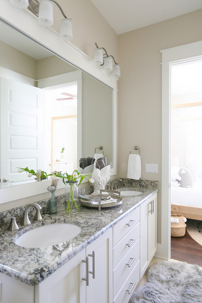 Bathroom with white and grey granite countertop. The white granite is Cambridge White Granite. Bathroom with durable white and grey granite countertop #Bathroom #whiteandgreygranite #granitecountertop #bathroomgranitecountertop JoAnn Regina Home