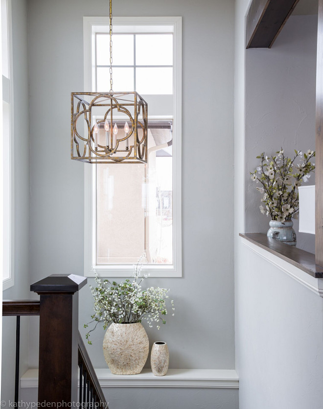 Benjamin Moore Revere Pewter. Wall color on the whole main floor is Benjamin Moore Revere Pewter. Lighting is Currey and Company Cosette Lantern #BenjaminMooreReverePewter Restyle Design, LLC.