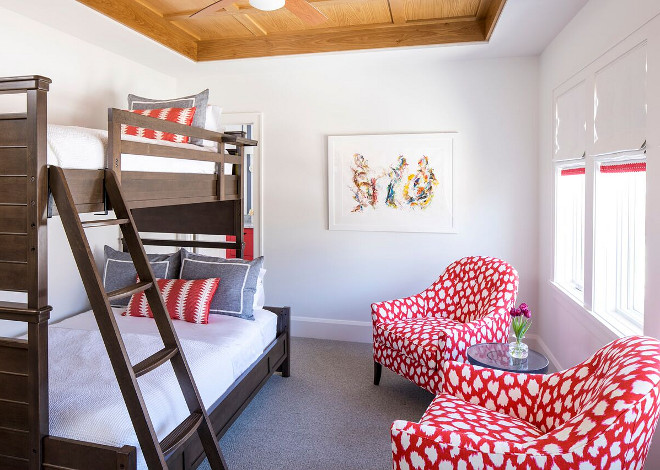Bunkroom. Kids Bunk room Ideas. This guest bedroom becomes more practical with a store-bought bunk bed. The space also features two custom chairs in Kate Spade fabric. Aren't they beautiful?! Store bought bunk beds bunk room. #Bunkroom #KidsBunkroom #KidsBunkroomIdeas #Storeboughtbunkbed #Storeboughtbunkbeds #bunkroom Martha O'Hara Interiors