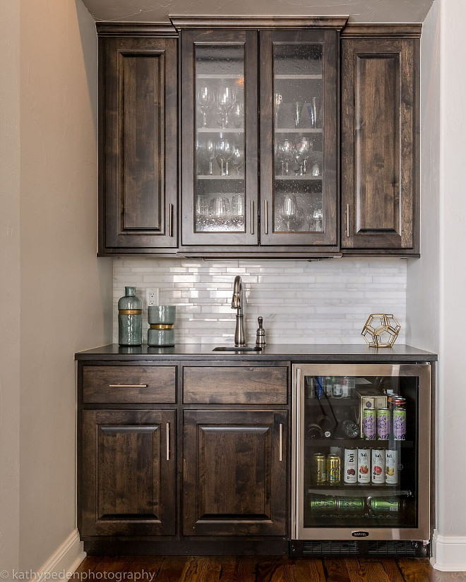 Butlers Pantry cabinet. Dark Stained Butlers Pantry Cabinet Butlers Pantry cabinet. This butler's pantry has an elegant feel with black walnut stained cabinetry, marble backsplash, and stainless hardware. Dark Stained Butlers Pantry Cabinet #ButlersPantry #ButlersPantrycabinet #DarkStainedCabinet #ButlersPantryCabinet Restyle Design, LLC.