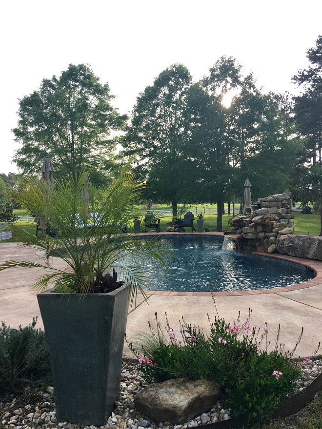 Country home backyard. Country home backyard with pool and waterfall. The waterfall is built out of riverstone. #Countryhome #backyard #pool #waterfall Beautiful Homes of Instagram @cindimc.ivoryhome