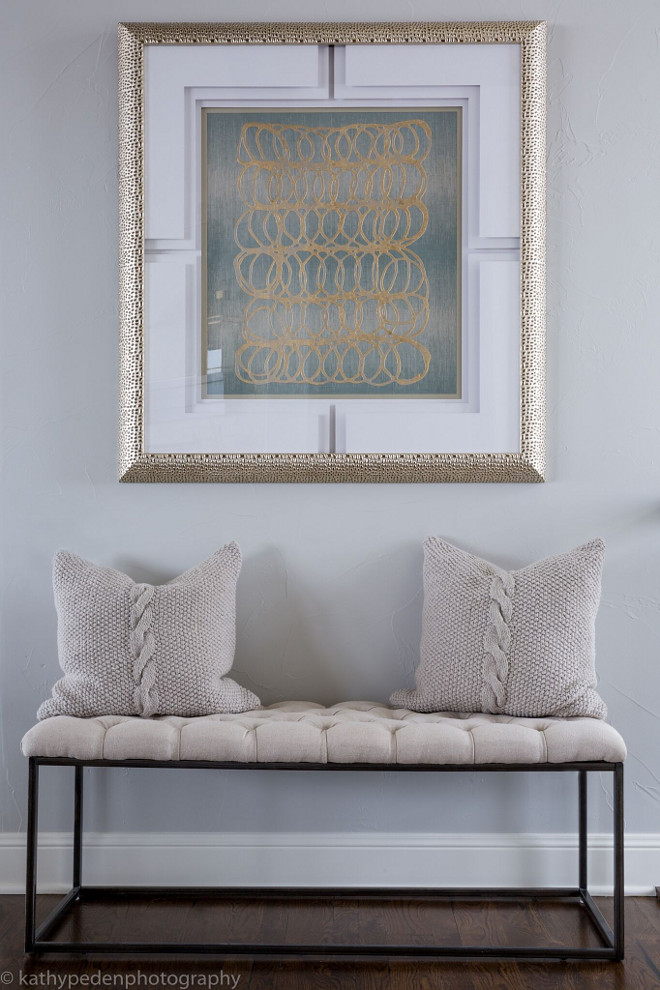 Entry. Entry Decor. Tufted upholstered bench by Classic Home Furnishings and contemporary artwork by Paragon create impact in this entry. Cable knit pillows by Villa Home. #Entry #Entrydecor Restyle Design, LLC.
