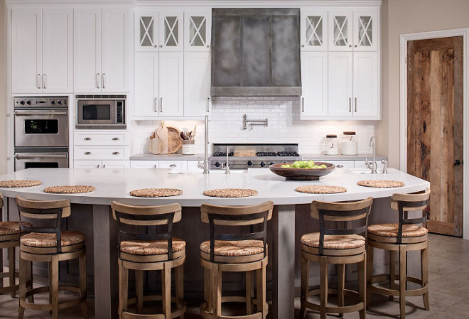 Farmhouse Kitchen with Reclaimed wood pantry door and zinc hood. White Farmhouse Kitchen with Reclaimed wood pantry door and zinc hood. White farmhouse kitchen with reclaimed wood pantry door and zinc hood. The custom zinc hood is by Fine Design Fabrication. The custom Barn wood pantry door is Karten’s Case #FarmhouseKitchen #kitchen #Reclaimedwoodpantrydoor #Reclaimedwood #pantrydoor #zinchood #Whitefarmhousekitchen Tracy Lynn Studio