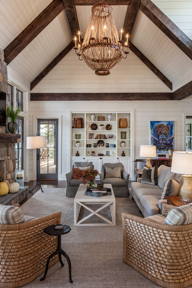 Farmhouse Living room with floor to ceiling shiplap. Farmhouse Living room features floor-to-ceiling shiplap, exposed beams on vaulted ceilings, rope and iron chandelier and a pair of natural fiber chairs. Chandelier is a Luigi Chandelier by Solaria Lighting. Farmhouse Living room with floor to ceiling shiplap design ideas. Farmhouse Living room with floor to ceiling shiplap. Farmhouse Living room with floor to ceiling shiplap design ideas. Farmhouse Living room with floor to ceiling shiplap. Farmhouse Living room with floor to ceiling shiplap design ideas #Farmhouse #shiplap #ShiplapLivingroom #farmhouseLivingroom #Livingroomshiplap #floortoceilingshiplap #shiplap Wright Designdesign ideas