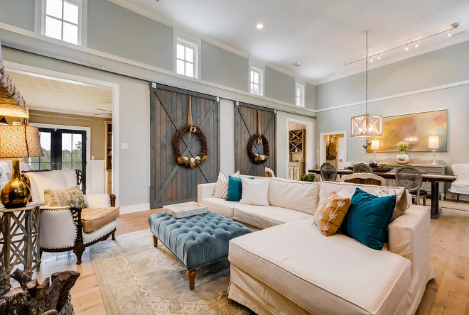 Fixer Upper style farmily room with barn doors. Paint color is Restoration Hardware Silver Sage #FixerUpper #familyroom #barndoors #Paintcolor #RestorationHardwareSilverSage Van Wicklen Design