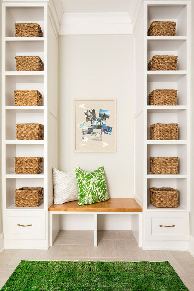 Mudroom Shelves. Mudroom with open shelves for baskets Mudroom Shelves. Wall color is Benjamin Moore Light Pewter 1464 and cabinets are Sherwin Williams SW 7004 Snowbound. Mudroom with open shelves for baskets #MudroomShelves #Mudroom #openshelves #baskets #mudroombaskets #BenjaminMooreLightPewter #BenjaminMooreLightPewter1464 Martha O'Hara Interiors