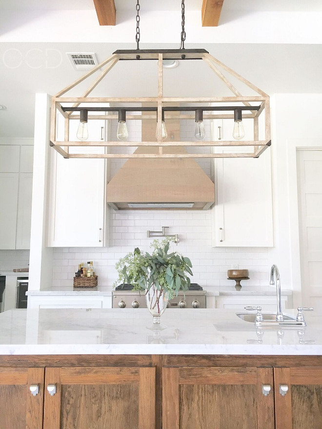 Rustic Lighting. The rustic lighting is "Fredrick Ramond FR41205IRR Emilie 5 Light 42 inch Iron Rust Linear Chandelier Ceiling Light". Rustic Kitchen Lighting. The kitchen hood is White Oak with a Classic Grey stain. Rustic Linear Lighting. Farmhouse Kitchen Lighting. #RusticLighting #KitchenLighting #rustickitchenlighting #Rusticlinearlighting #linearlighting Beautiful Homes of Instagram @organizecleandecorate