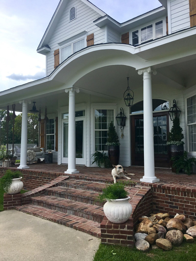 Traditional Farmhouse with Brick Porch. Traditional Farmhouse with Brick Porch. Our house is truly a Southern farm house. White Hardie Board siding, with hand made cypress shutters. The brick is solid and is made in molds by hand to look like old brick the name is Orleans. Traditional Farmhouse with Brick Porch #TraditionalFarmhouse #Brick #Porch Beautiful Homes of Instagram @cindimc.ivoryhome