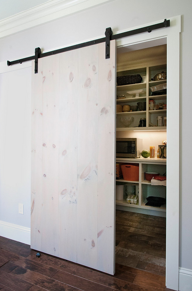 Whitewash barn door. Simple Whitewash barn door. Barn doors have been seen in many Fixer Upper episodes and I specifically like this one, designed by Gulfshore Design. Simple whitewashed pine planks makes a great barn door! Whitewash pine barn door #Whitewashbarndoor #Whitewash #barndoor #simplebarndoorideas #Whitewashpine #pinebarndoor #pinedoor Gulfshore Design