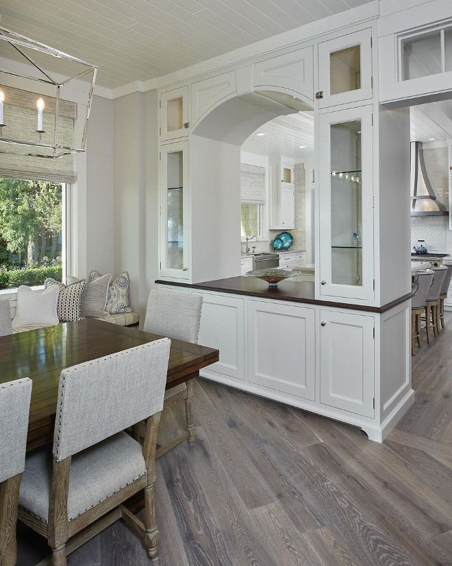 Arched Cabinet separates kitchen from Dining area. A cabinet with a "pass-trough" arch separates the kitchen from the dining area. Kitchen Cabinet Ideas. Kitchen Dining room layout. Arched Cabinet separates kitchen from Dining area. #ArchedCabinet #kitchen #Diningarea #KitchenCabinetIdeas #KitchenDiningroom #KitchenDiningroomlayout #ArchedCabinet Regina Andrew Clear Glass Pendant Light