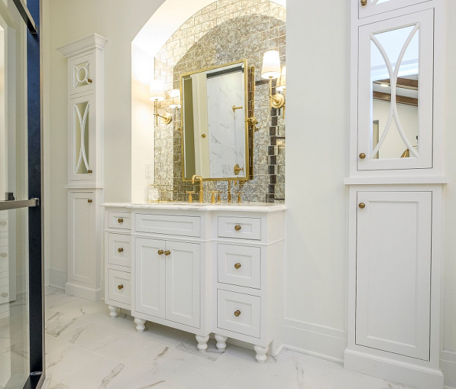 Bathroom Cabinet tucked into an arched niche and two cabinet towers on both sides. The other side of the bathroom features another cabinet tucked onto an arched niche anchored by two cabinet towers with mirrored doors. Bathroom Cabinet tucked into an arched niche and two cabinet towers on both sides. #BathroomCabinet #Cabinetniche #Bathroom #Cabinet #Bathroomniche #niche #archedniche #cabinets Ramage Company