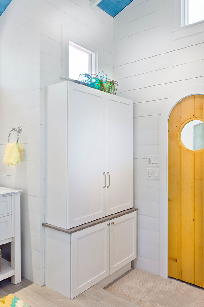 Bathroom shiplap. Bathroom linen cabinet and shiplap walls.Accents of turquoise and yellow create a happy atmosphere #shiplap #cabinet Younique Designs