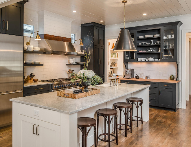 Black and white kitchen. Kitchen with black perimeter cabinets and white white island and shiplap backsplash and shiplap ceiling #Blackandwhitekitchen #Kitchen #blackperimetercabinets #whiteisland #shiplap #shiplapbacksplash #shiplapceiling Domaine Development