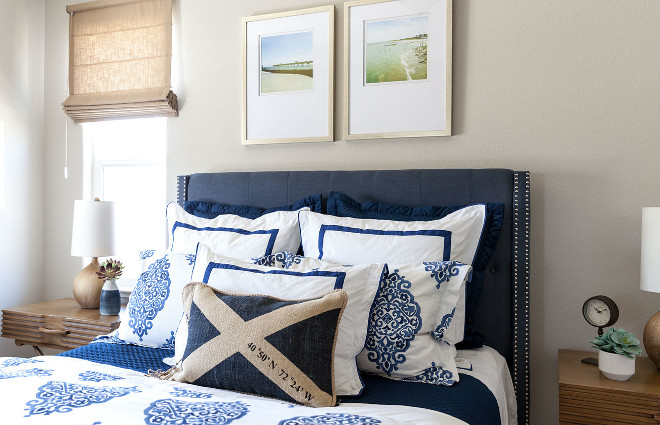 Blue and white bedding with navy bed. Coastal chic bedroom with Blue and white bedding and navy bed. #Coastal #bedroom #Blueandwhite #bedding #navybed Juxtaposed Interiors