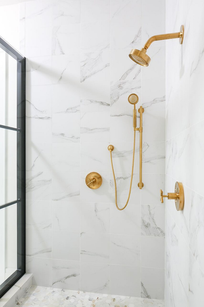 Carrara Marble Shower with Kohler Purist Brass Shower Faucet. I love the contrast of elements found in this bathroom! Notice the brass shower fixtures with the Carrara marble tile and the black shower frame. Flooring is a marble hex tile. Carrara Marble Shower Tile with Kohler Purist Brass Shower Faucet. Carrara Marble Shower with Kohler Purist Brass Shower Faucet #CarraraMarble #CarraraMarbleShower #CarraraMarbleShowerTile #showertile #Kohler #Purist #Brass #Shower #Faucet Ramage Company