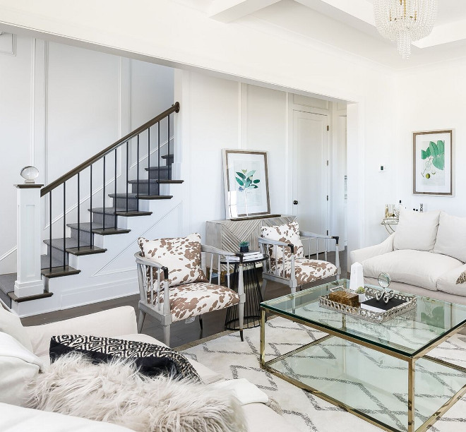 Cowhide chairs. Cowhide chair. The cowhide accent chairs and the brass coffee table are by Caracole. Cowhide accent chair ideas #Cowhidechairs #Cowhidechair Ramage Company. Leslie Cotter Interiors, LLC