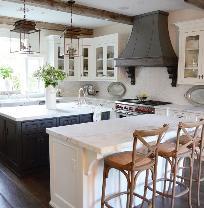 Farmhouse Kitchen. Farmhouse Kitchen with Ceiling Beams. We loved the mix of wood and metal and felt that it set the right tone for the country farmhouse look we wanted to achieve. We also added reclaimed wood beams to bring in additional warmth. Farmhouse Kitchen Hood. Farmhouse Kitchen Hood Corbels. Farmhouse Kitchen Marble Countertop. Farmhouse Kitchen Island. Farmhouse Kitchen Lighting. Farmhouse Kitchen #FarmhouseKitchen #Farmhouse #Kitchen #FarmhouseKitchenCeilingBeams #ceilingbeams #FarmhouseKitchenHood #kitchenhood #FarmhouseKitchenHoodCorbels #hood #corbels #FarmhouseKitchenMarbleCountertop #MarbleCountertop #FarmhouseKitchenIsland #KitchenIsland #FarmhouseKitchenLighting #KitchenLighting #Kitchen #Lighting #FarmhouseKitchens #FarmhouseKitchen Beautiful Homes of Instagram @SanctuaryHomeDecor