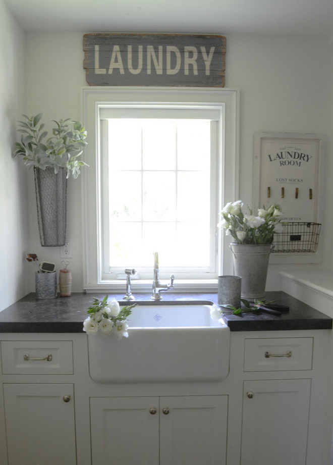 Farmhouse Laundry room. White Farmhouse Laundry room. The laundry room doubles as my flower arranging space and is one of my creative hideaways in our home. Countertop is Belgian Bluestone. #FarmhouseLaundryroom #whiteLaundryroom #whitefarmhouseLaundryroom #Laundryroom Beautiful Homes of Instagram @SanctuaryHomeDecor