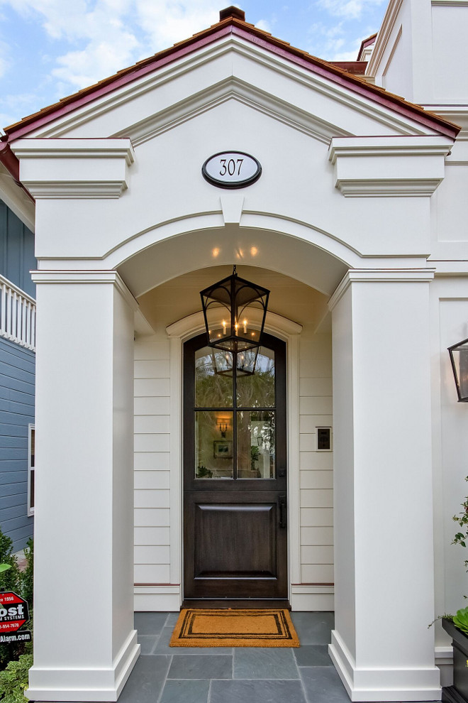 Front Door Entry. Front Entry. This traditional entry features a stunning arched front door. Traditional front entry, front door, house number, glass front door, front door matt, exterior pendant, white siding. Front Door Entry. Front Entry. Traditional front entry, front door, house number, glass front door, front door matt, exterior pendant, white siding #FrontDoor #FrontEntry #Door #Entry #Traditionalentry #tradionalfrontdoor #housenumber #glassfrontdoor #frontdoormatt #doormatt #exteriorpendant #whitesiding Brandon Architects, Inc.