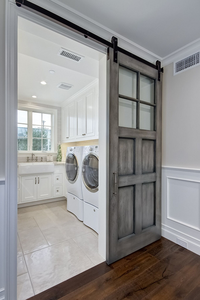 Glazed Barn Door. Laundry room with glazed barn door. Glazed Barn Door Glazed Barn Doors. Glazed Barn Door #GlazedBarnDoor #BarnDoor #slidingBarnDoor Brandon Architects, Inc.