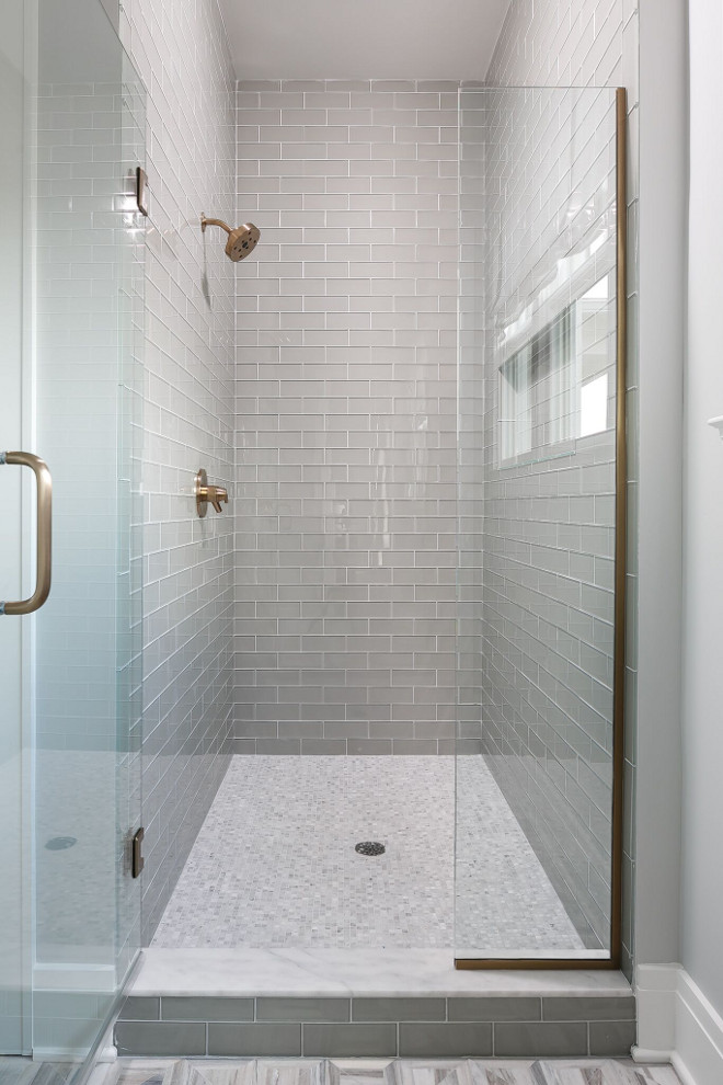 Grey Shower Glass Subway Tile. Neutral Grey Shower Glass Subway Tile. The master shower wall tile is MLW Stone Shiny Frost 3 x 8 glass tile. The shower floor is 5/8 x 5/8 Carrara marble mosaic tile. Grey Shower Glass Subway Tile. Grey Shower Glass Subway Tile #GreyShowerTile #GreyGlassSubwayTile Ramage Company. Leslie Cotter Interiors, LLC