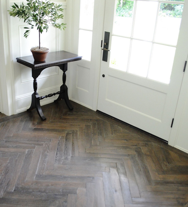 Herringbone Hardwood Floor. Entry Herringbone Hardwood Floor Ideas. The wood flooring throughout the house is French oak, with a custom finish. We chose a herringbone pattern in the entry, dining room, library and guest cottage and 11” wide planks throughout the remainder of the house. Herringbone Hardwood Floor #HerringboneHardwoodFloor #HerringboneHardwoodFloorIdeas Beautiful Homes of Instagram @SanctuaryHomeDecor
