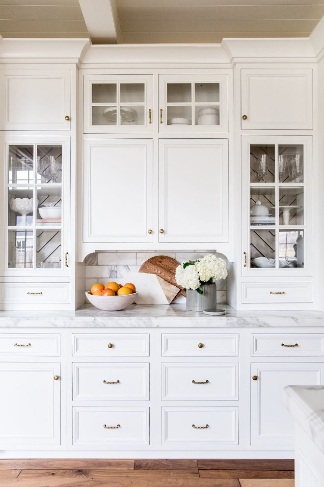 Kitchen Buffet Cabinet with white marble, brass hardware, stacked cabinets with glass doors and custom cabinet trim #KitchenBuffetCabinet #Kitchen #BuffetCabinet #KitchenCabinet #whitemarble #brasshardware #stackedcabinets #cabinetglassdoor #customcabinettrim Pink Peonies Rachel Parcell's Kitchen