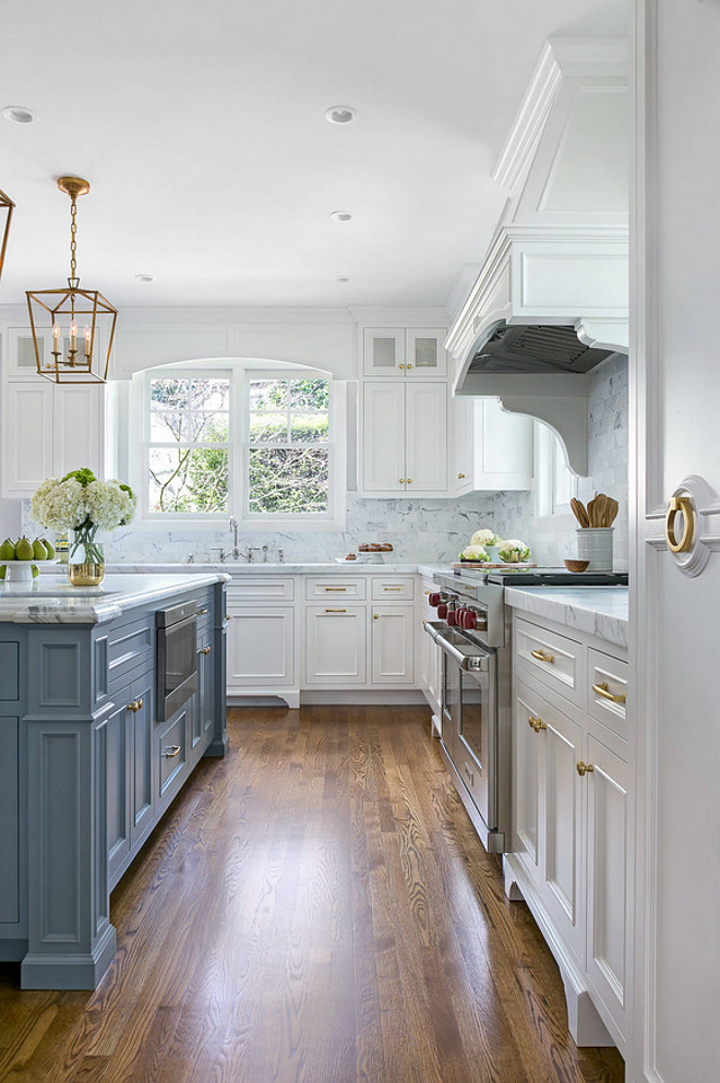 White Kitchen with Stacked Cabinets and Grey Island - Home Bunch