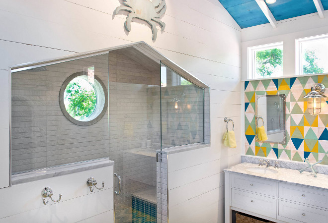 Transom windows let in plenty of natural light without sacrificing privacy in this bathroom. #bathroom #shiplap #coastalfarmhouse Younique Designs