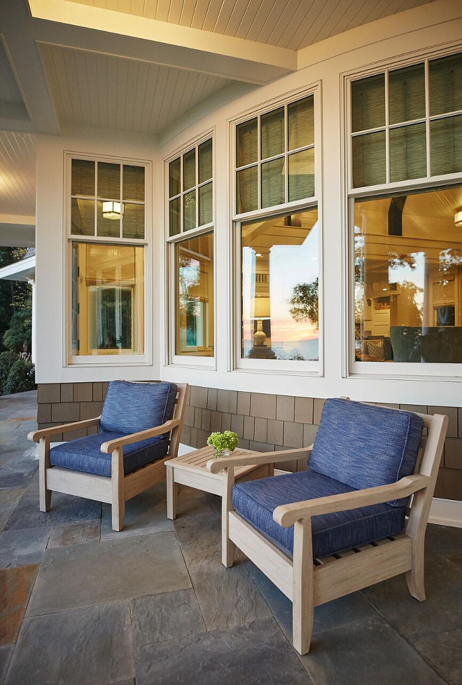 Porch Chairs. Porch Chair Ideas. Porch with bluestone tile and a pair of outdoor chairs. #porch #bluestone #porchchairs #chairs #outdoorchairs Benchmark Wood & Design Studios - Mike Schaap Builders